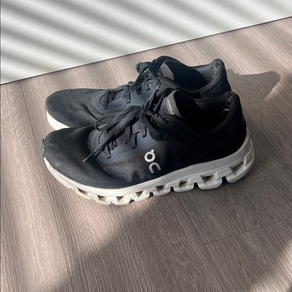 On Clouds Running Black and White Athletic Shoes